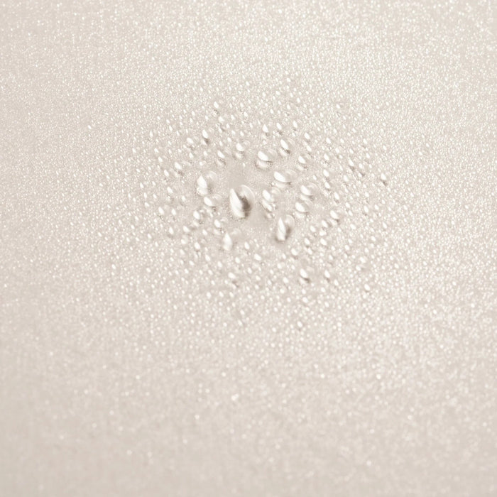 Shop Rescue Spa Serene Scalp Densifying Treatment Spray with water droplets on a textured beige surface