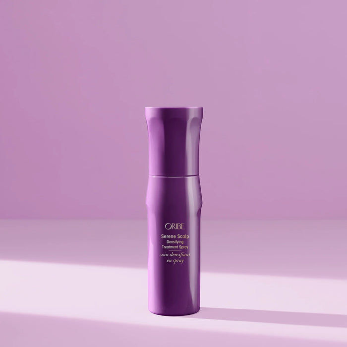 Shop Rescue Spa Oribe Serene Scalp Densifying Treatment Spray in a purple bottle against a matching purple background.