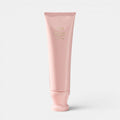 Shop Rescue Spa Oribe Serene Scalp Exfoliating Scrub in a pale pink 125ml squeeze tube for scalp purification.