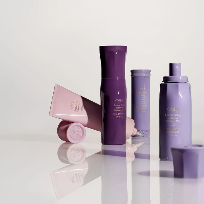 Shop Rescue Spa Serene Scalp Exfoliating Scrub in a pink tube with a purple cap, alongside other Oribe hair products.