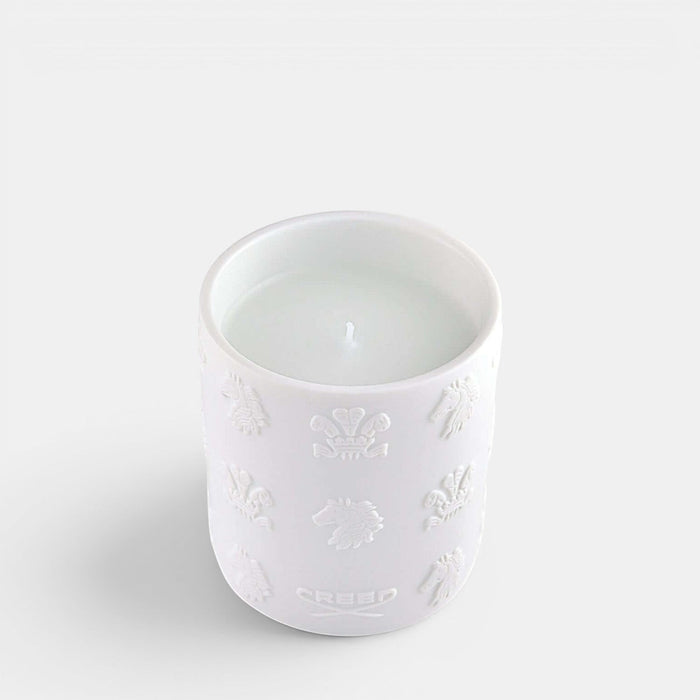 Shop Rescue Spa white Silver Mountain Water scented candle in a textured ceramic vessel with embossed logo details.