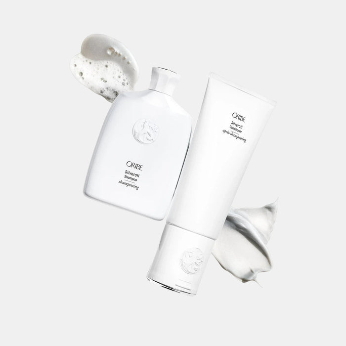 Shop Rescue Spa ORIBE Silverati Conditioner tube with white cream swatch and ORIBE Silverati Shampoo bottle with foam swatch.