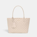 Shop Rescue Spa Sand Small Daily Tote in quilted beige nylon with Italian leather handles and light gold hardware.