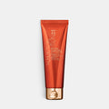 Shop Rescue Spa SPF 45 mineral body sunscreen in a sleek orange tube with a gold cap for broad-spectrum protection.