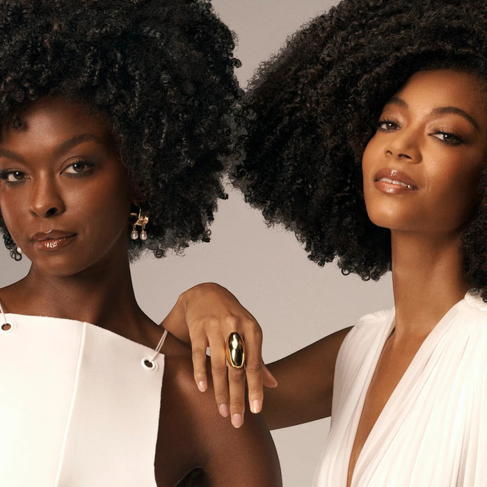 Shop Rescue Spa Styling Butter Curl Enhancing Cream on two women with defined coily curls. Shea butter and avocado oil.
