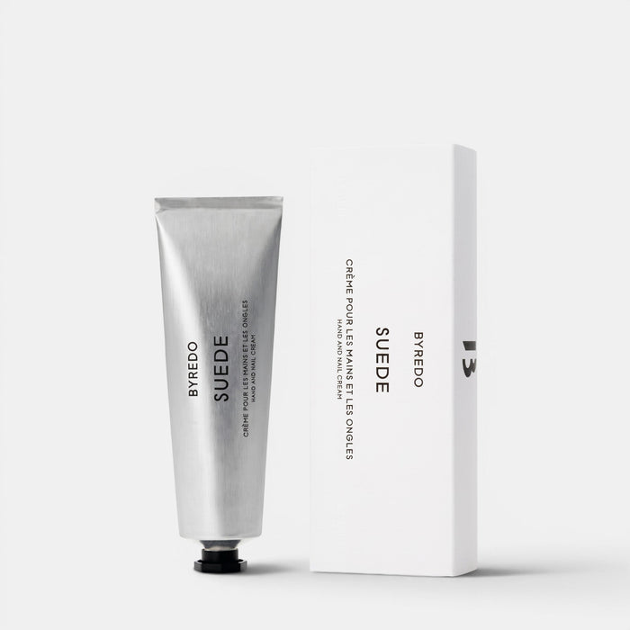 Shop Rescue Spa Byredo Suede hand and nail cream in a silver tube next to its white minimalist product box.
