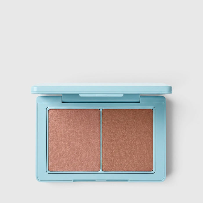 Shop Rescue Spa Sun Tone Bronzing Crème duo in a light blue compact with two complementary tan shades.