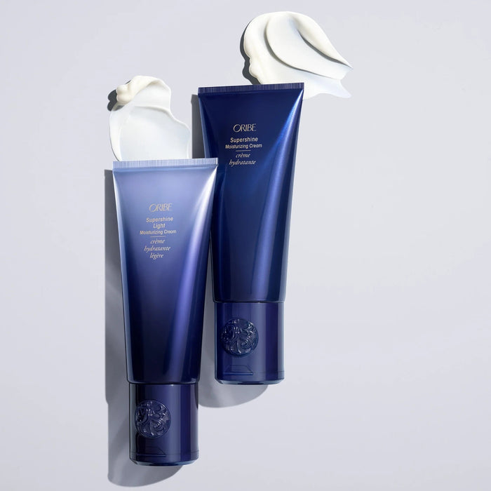 Shop Rescue Spa Oribe Supershine Light Moisturizing Cream tubes with white cream swirls. Lightweight conditioner for fine-to-medium hair.