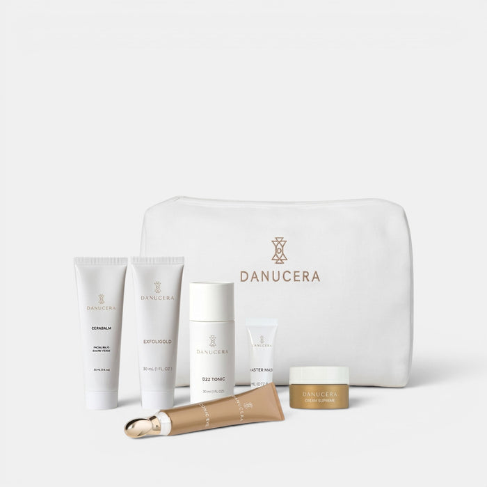 Shop Rescue Spa Danucera On-The-Go Kit featuring six travel-sized skincare products in a signature white beauty bag.