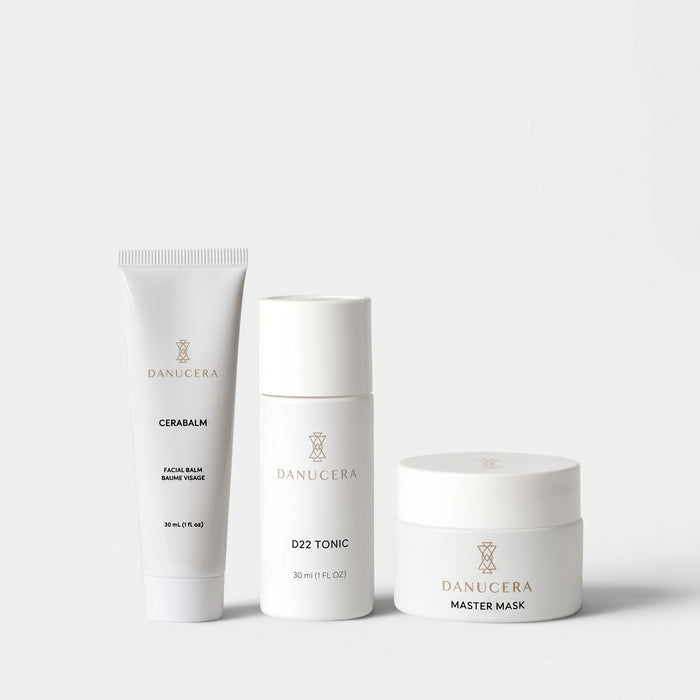 Shop Rescue Spa The Glow Trio skincare set featuring Danucera Cerabalm, D22 Tonic, and Master Mask in white bottles.