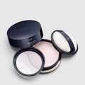 Shop Rescue Spa translucent loose powder in a navy compact with a soft application puff for a luminous finish