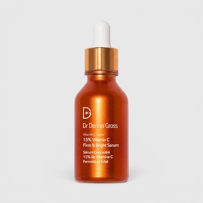 Shop Rescue Spa Dr Dennis Gross Vitamin C Lactic 15% Firm & Bright Serum in an orange glass dropper bottle.