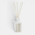 Shop Rescue Spa Antica Warm White reed diffuser in an elegant matte white apothecary bottle with natural reeds.
