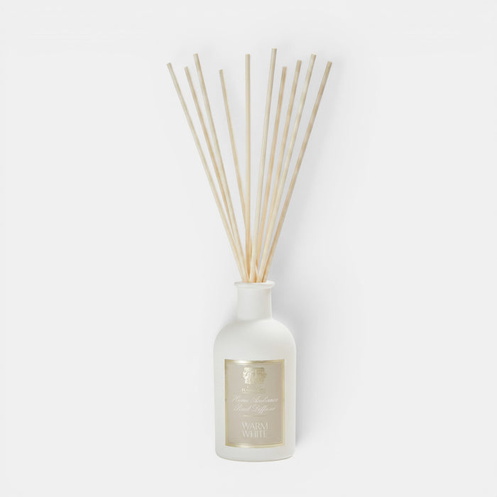 Shop Rescue Spa Warm White reed diffuser in a white apothecary-style glass bottle with natural wooden reeds.