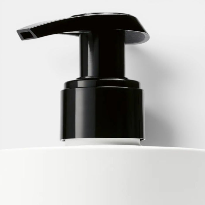 Shop Rescue Spa Yuzu Tree Hand Lotion with black pump dispenser on white bottle. Citrus scent.