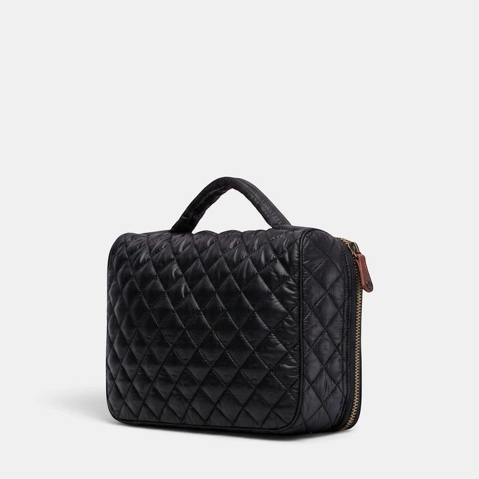 MZ Wallace black quilted cosmetic case with a wraparound zip closure, top handle, and Italian leather trim.